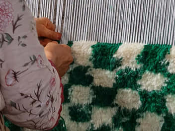 berber checkered rug in the making